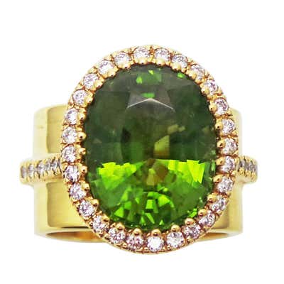 8.49 Carat Burmese Peridot and Diamond Halo Gold Ring